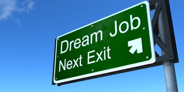 A highway exit sign reads, “Dream Job Next Exit.”